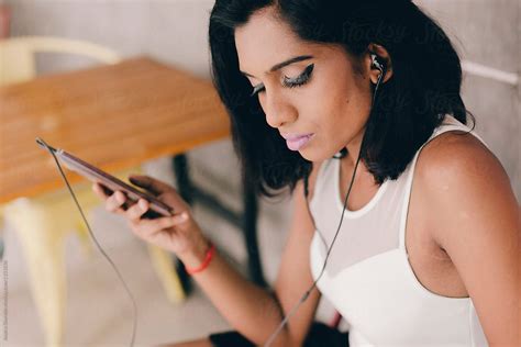 Young Professional Indian Woman Using Technology By Jessica Lia