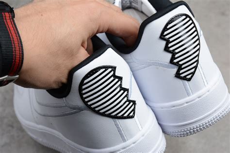The nike air force 1s include tongues that can pop open and closed with buttons, reading: Nike Air Force 1 Low "Valentine's Day" White/White-Black ...