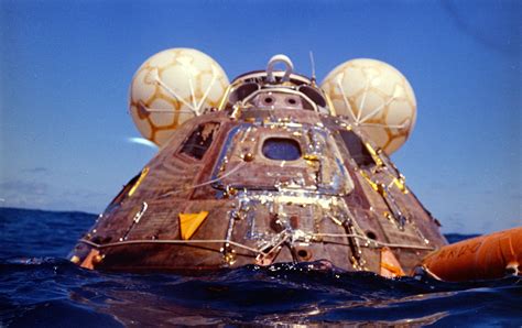 Apollo 16 Command Module After Splashdown The Recovery Raft Is On The