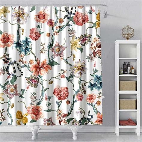 A Bath Tub Sitting Next To A Shower Curtain With Flowers On It In A