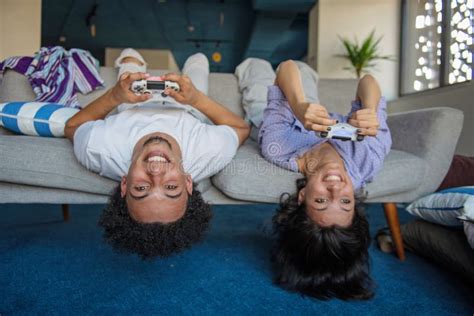 Young Couple Enjoying Playing Video Games Together Stock Image Image