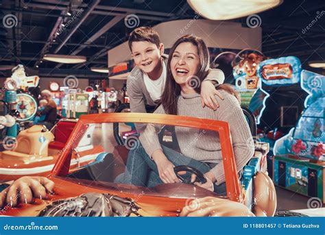 Happy Mom And Son Sitting On Toy Car Stock Image Image Of Laughing