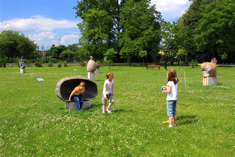 Filechildren Playing On The Lawn Outside The Regional Museum In