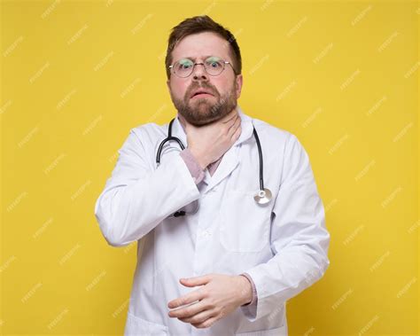 Premium Photo Doctor In A White Coat Feels A Sore Throat Or