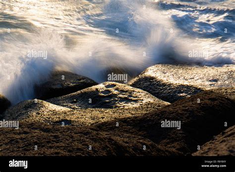 Waves Breaking On The Rocks Stock Photo Alamy