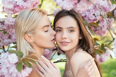 Portrait Of A Two Beautiful Spring Girls Two Young Women Relaxing In