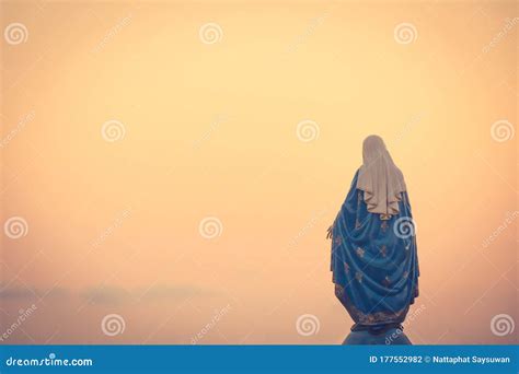 The Blessed Virgin Mary Statue Figure In A Warm Tone Sunset Scene Catholic Praying For Our