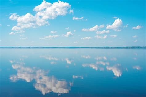 Premium Photo Cloudscape Clouds In Blue Sky And Reflection In A