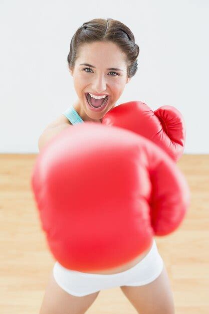 Premium Photo Beautiful Playful Woman In Red Boxing Gloves At Fitness