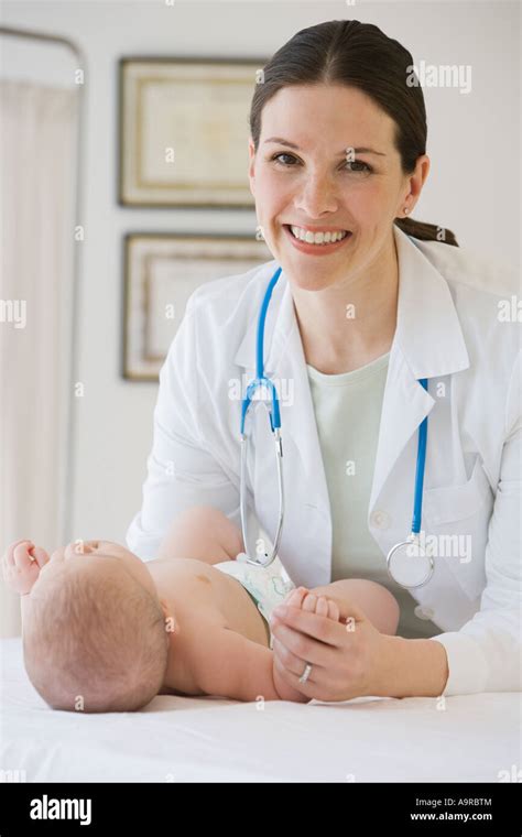 Female Doctor Examining Baby Stock Photo Alamy