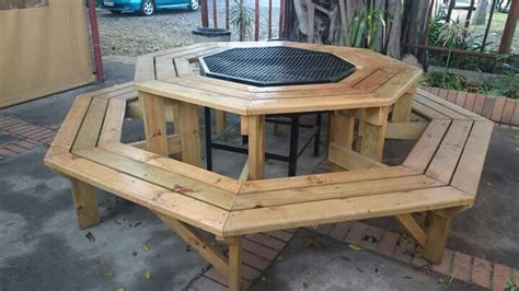 The living includes table for four, and a kitchenette. Octagonal Barbeque and Firepit with table (With images ...