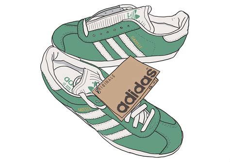 The Adidas Sneakers Are Green And White With A Brown Tag Hanging From