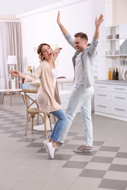 Premium Photo Cute Young Couple Dancing At Home