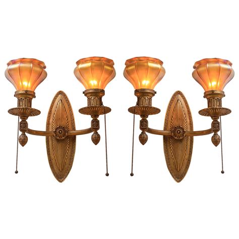 With soft up and downlight and three different window styles, the art sconce is a charming addition to any space. Gilt Bronze and Art Glass Sconces at 1stdibs
