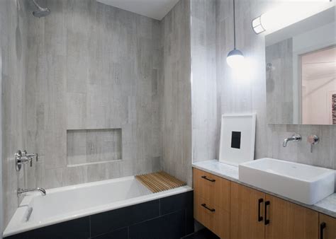 This minimal, rustic bathroom makes the best out of the least amount of decor possible, with a wooden ladder for the towels, a concrete floor, and open wood vanity. Renovating a Bathroom? Experts Share Their Secrets. - The ...