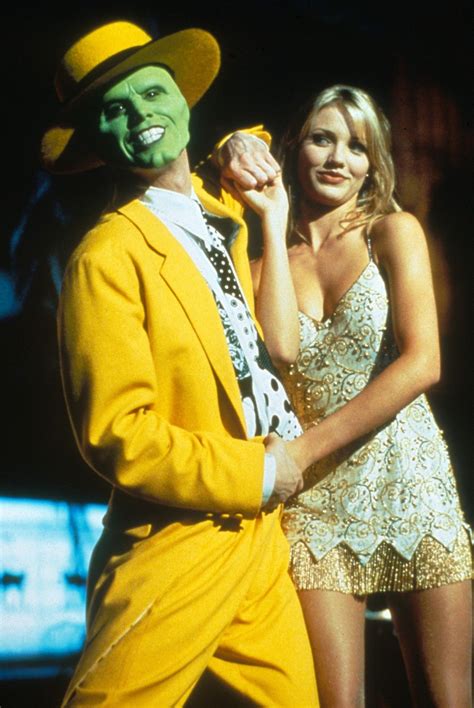 An Image Of A Man In A Yellow Suit And Woman In A White Dress On The Screen
