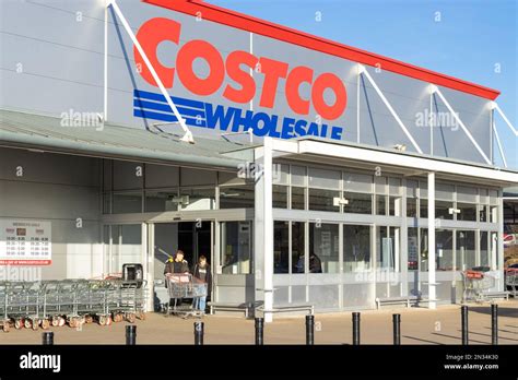 Costco Uk Costco Store Costco Wholesale People With Shopping Trollies