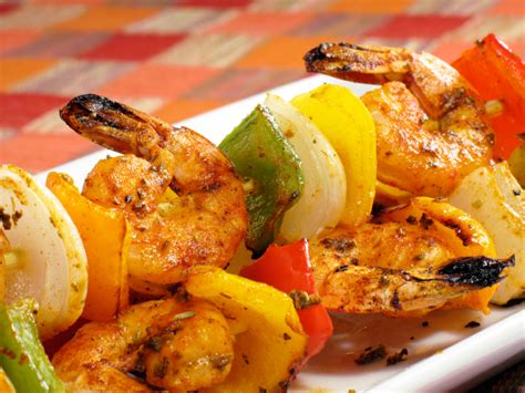 Adding pieces of vibrant vegetables like bell pepper and red onion add a pop of color and shrimp cook very quickly, so you'll have to watch your shrimp to make sure they don't overcook. Grilled Cajun Shrimp Skewers - Party Perfect for Festive ...