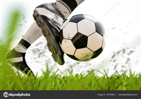 Futbolista pateando pelota de fútbol en movimiento fotografía de stock phonlamai