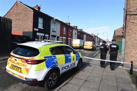 Two Arrested As Armed Police Shut Down Street And Surround Home