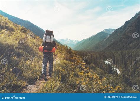 Tourist With Hiking Backpacks In Mountain Hike On Summer Day Tourist