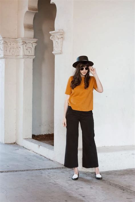 mustard sweater and wide leg crop pants jeans and a teacup winter outfit inspiration wide