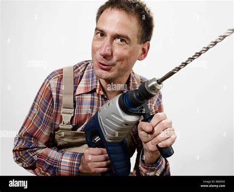 A Man Holding A Large Drill Stock Photo Alamy