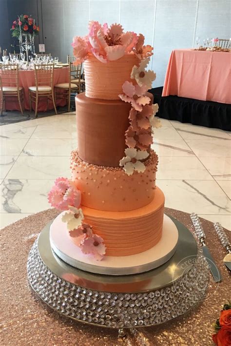 Peach Wedding Cake With Cascading Flowers And Pearls Modern And Fun