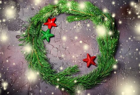 Green Christmas Wreath With Stars Decorations On Dark Background Stock