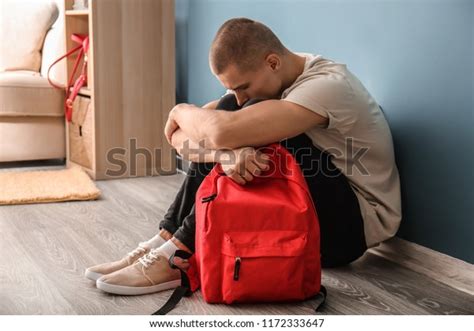 Sad Teenage Boy Sitting Near Color Stock Photo Edit Now