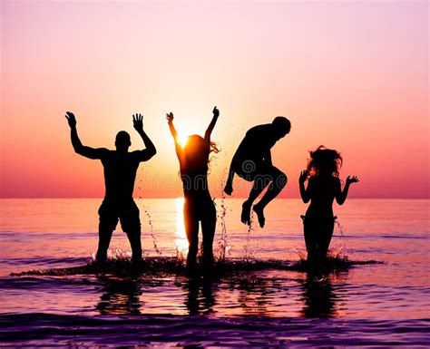 Silhouette Friends Sunset Water Stock Image Image Of Female Friends