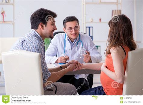 The Pregnant Woman With Her Husband Visiting The Doctor In Clinic Stock Image Image Of Check
