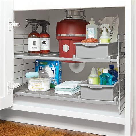 Your entire costco haul doesn't belong with containers, you can take out the unit as a whole and easily clean underneath, she says. Expandable Under Sink Organizer | The Container Store