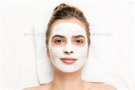 Spa Therapy For Attractive Woman Receiving Facial Mask Stock Photo By