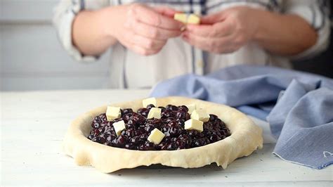 blueberry pie flaky crust and thick glaze y filling baking a moment