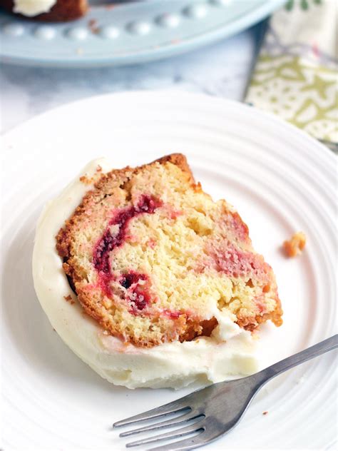 This white chocolate raspberry cake combines white chocolate cake layers with a white chocolate buttercream, fresh raspberries, and raspberry jam. White Chocolate Raspberry Bundt Cake - 5 Boys Baker