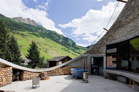 Take A Peek At A Stunning Secret Swiss Villa Hidden Into A Mountainside