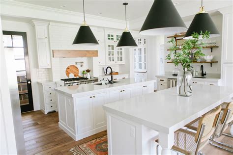 All the decor in this kitchen stands out against the white beaded board walls and island front, via better homes and. 15 Modern White Kitchens