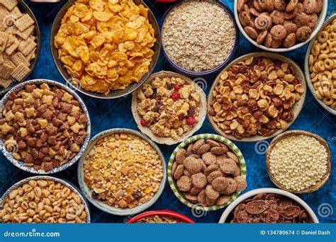 Assortment Of Different Kinds Cereals Placed In Ceramic Bowls On Table