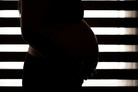 premium photo pregnant woman close up backlit unwanted pregnancy concept