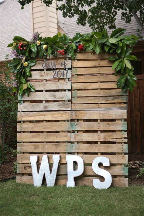 Pallet Photo Backdrop With Magnolia Leaves For Graduation Party