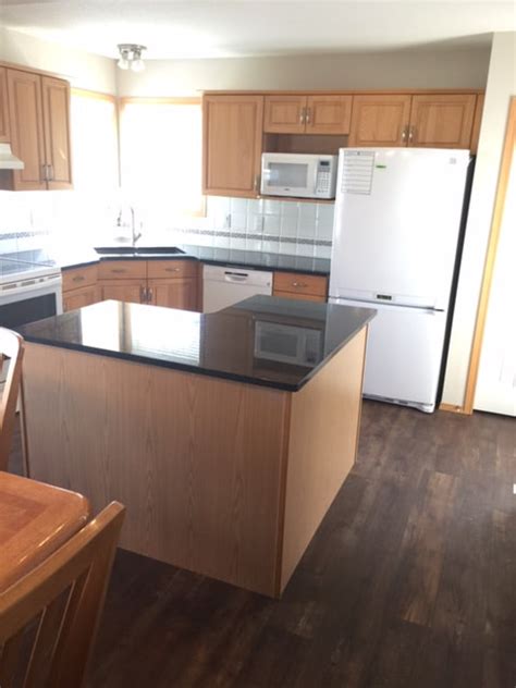 You can see in the photo above that cabinets and granite countertops have been installed before the floor. BEFORE & AFTER: Golden Oak Cabinets - LA Home Solutions ...