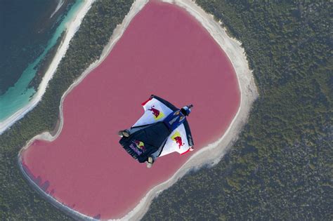 Wingsuit Flying Over A Pink Lake Video Dailymotion