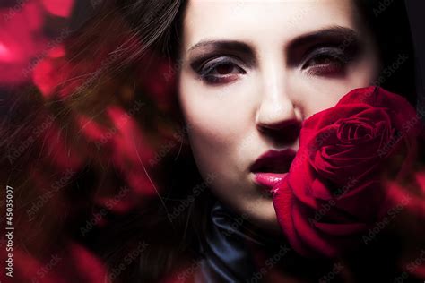 Beautiful Woman With Big Red Rose Stock Photo Adobe Stock