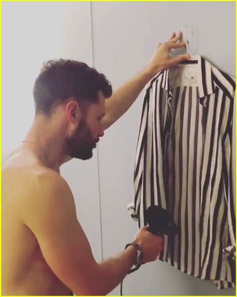 Calum Scott Goes Shirtless While Drying His Shirt On Tour Photo