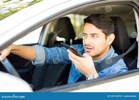 Man Using A Mobile Phone While Driving Stock Image Image Of Handsome