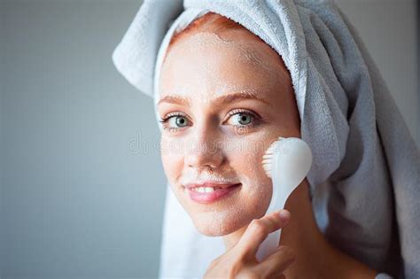 Woman Washing Cleaning Face And Skin With Brush Soap And Wather Stock