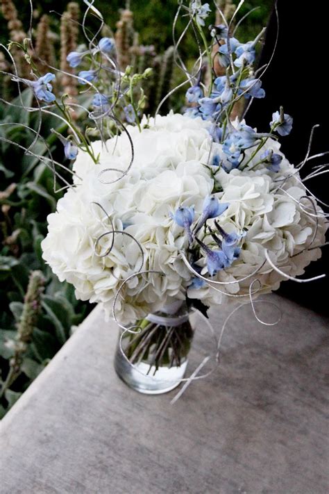 A Winter Inspired Wedding Bouquet With White Hydrangeas Blue