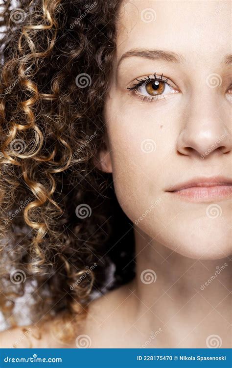 Beautiful Brunette Girl With Long Curly Hair Closeup Studio Portrait