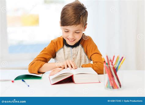 Smiling Student Boy Reading Book At Home Stock Image Image Of Room